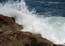 big ocean waves and rocks scene