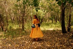 girl in princess costume in the forest