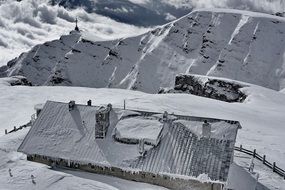Snowy house roof mountain landscape