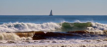 landscape of foamy surf waves on a sunny day