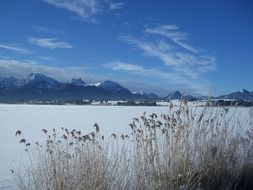 winter panorama of a frozen lake in the Alps, germany, allgÃ¤u