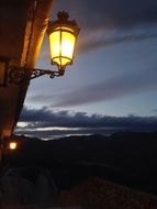 bright yellow street lamp at night