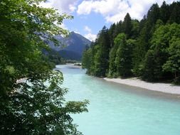 blue mountain river in Allgau on a sunny day