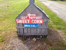 hot peppers and sweet corn farm sign