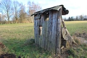 destroyed shed in the field