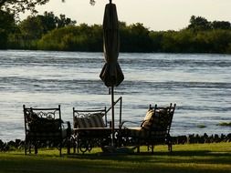 river rest on fancy chairs scene