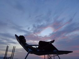 relaxing person in the deck chair