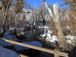 wooden bridge over a frozen river in California