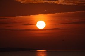 red sunset sun over the sea