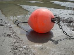 red Buoy on sand