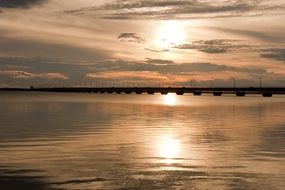 sunset in the evening sky above the water