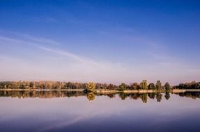 landscape of forest on a lake bank