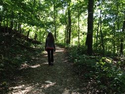 picture of the woman is in a forest