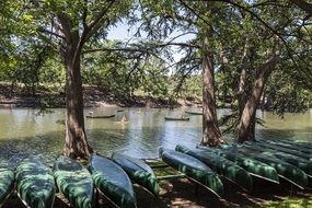 row of canoes by the river