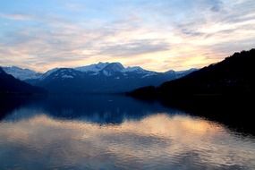 bright evening sky reflected in a mountain lake