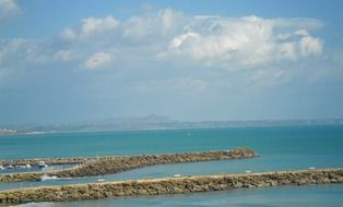 fascinating stone piers at coastline, italy, marinella