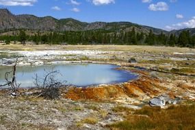 colorful erosion of soil at lake in wilderness, usa, wyoming, yellowstone national park
