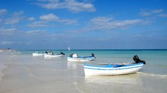 boats on a tunisian beach on a sunny day