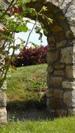 stone gate on green grass