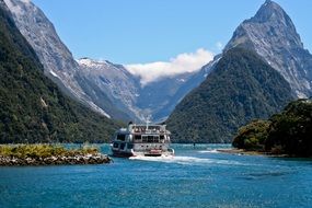 cruise ship in harbor of the new zealand among the mountains