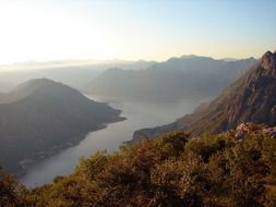 panorama of foggy morning in the valley of mountains