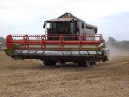 combine harvester on the autumn field