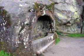 old stone grave in forest