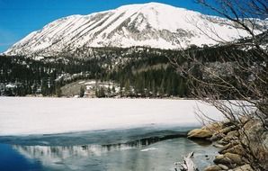 frozen lake in the background of the Sierras mountain system