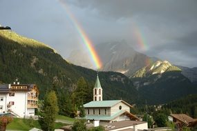 rainbow over mountain church