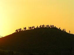 Lots of humans on a hill