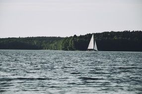 sailing boat on lake surface