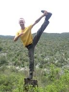 Man is doing yoga in nature