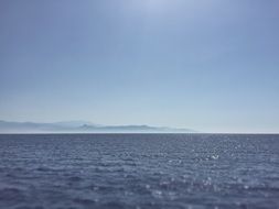 view from the water to an island with mountains