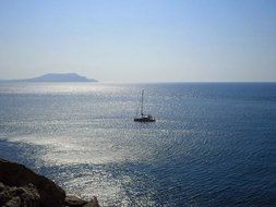 Landscape with the sailboat in the water