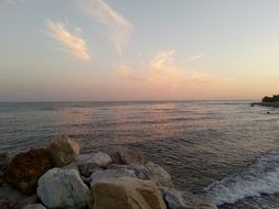 white and beige boulders by the sea