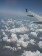 view of the clouds from the airplane porthole