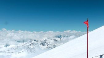 red flag on top of Elbrus