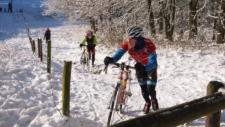 cyclists on the snow slope