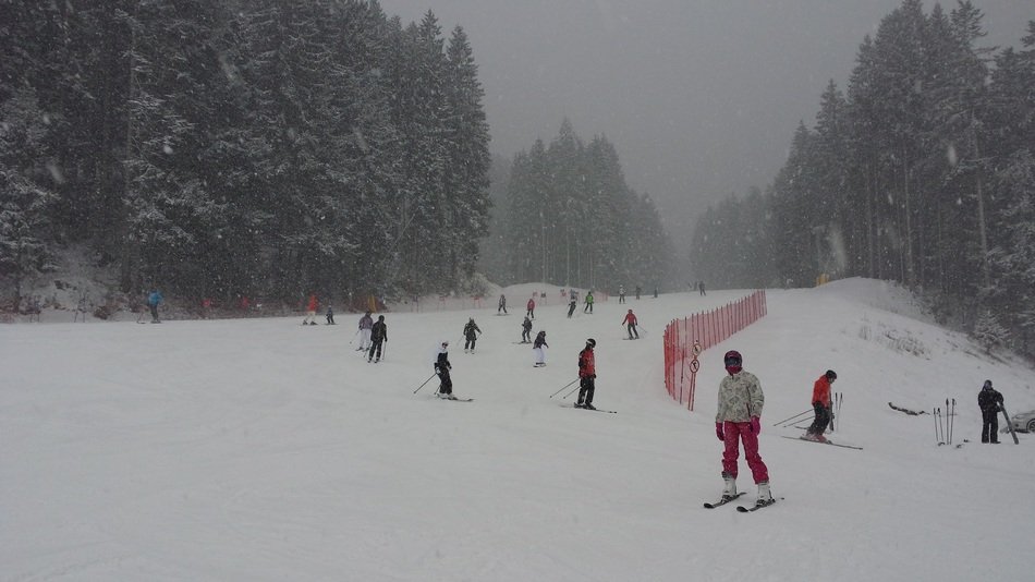 skiers in a haze in the dolomites