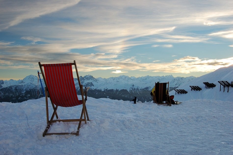 deck chairs on the background of a snowy landscape