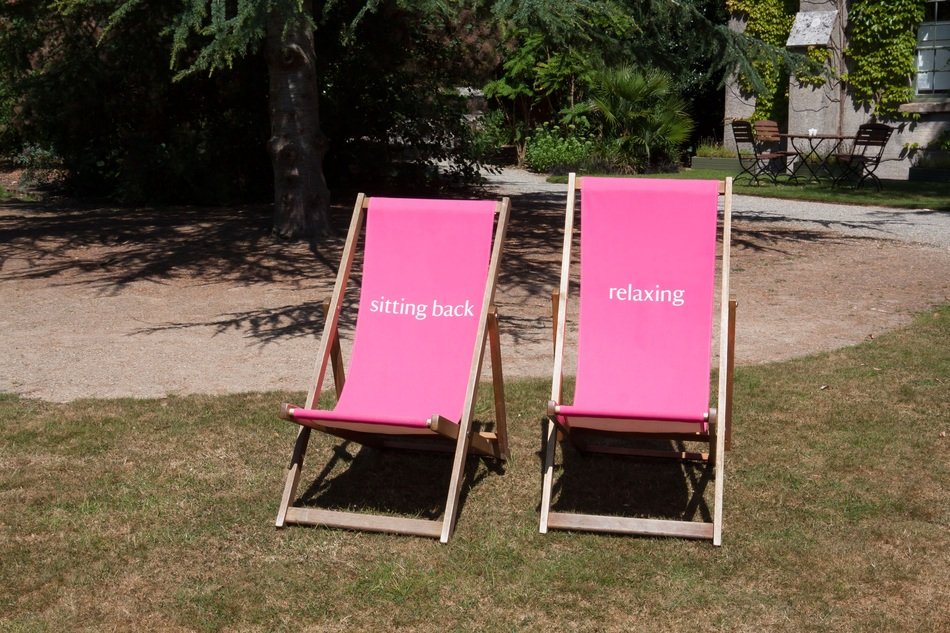 two pink loungers on the lawn
