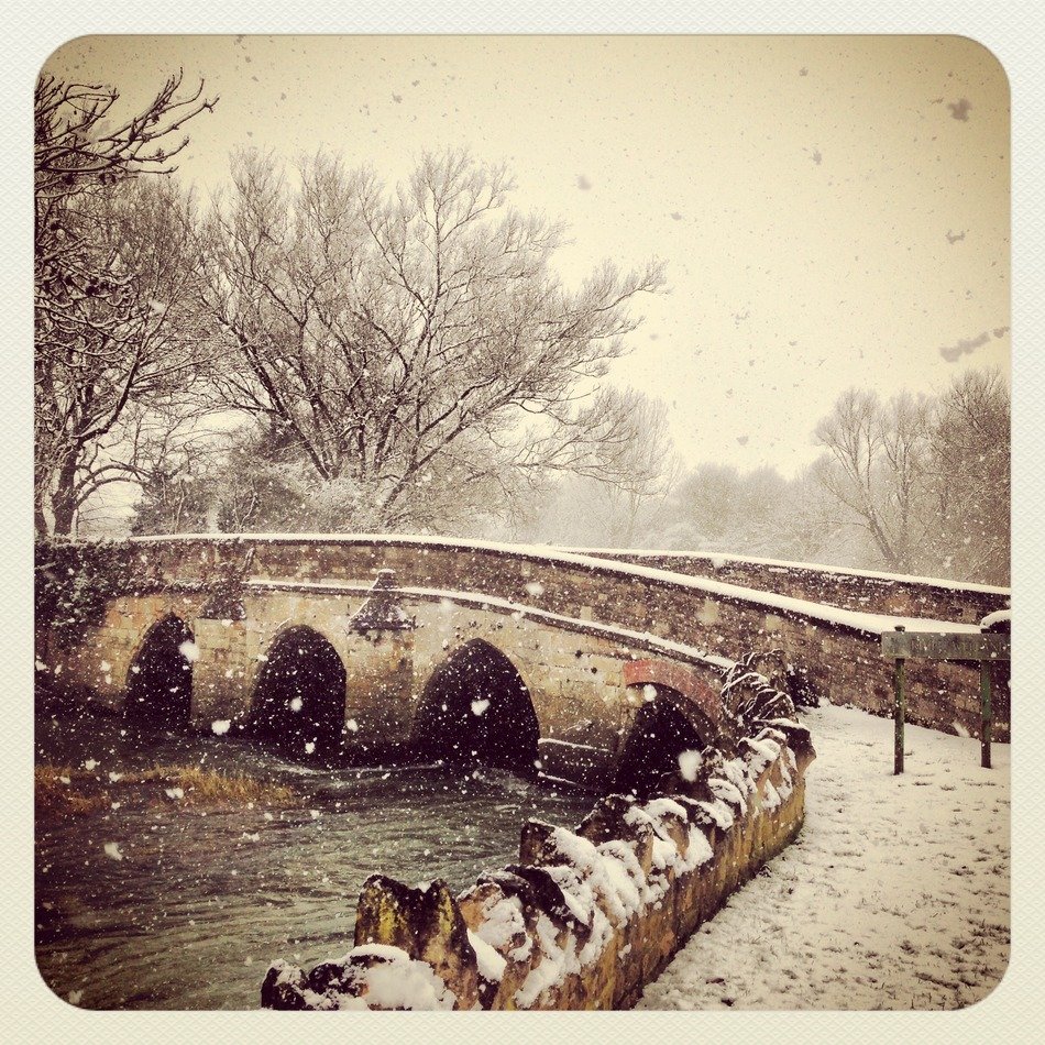 snow over the stone bridge
