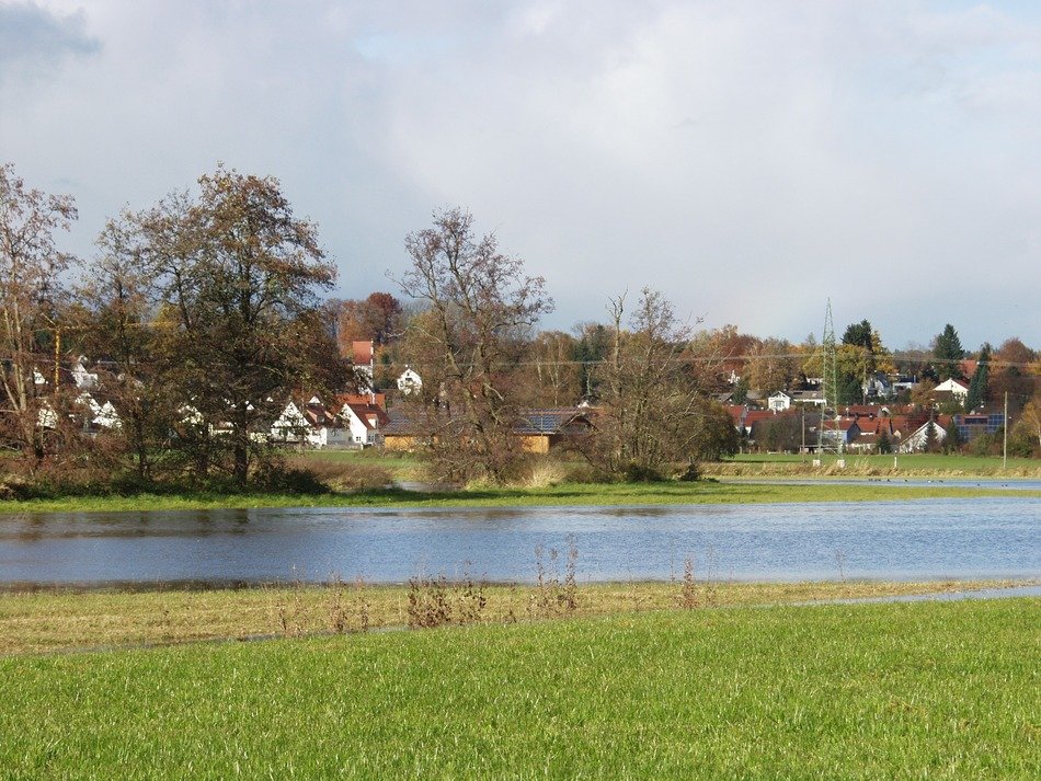 river flooding meadows in countryside