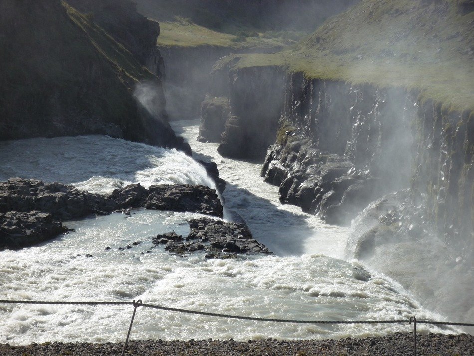 waterfall among the stones with a spray of water