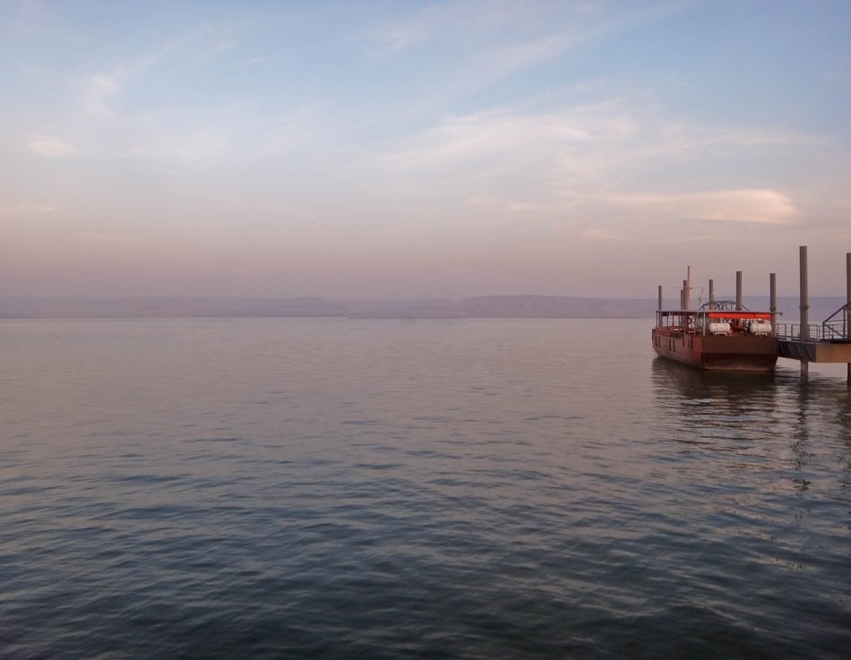 ship near the pier in the ocean