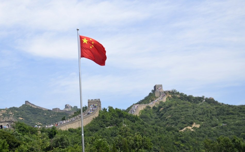 flag of China near the Great Wall of China