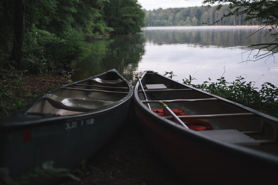 two boats by a lake