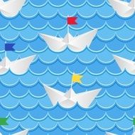 Paper boats sailing on blue paper water