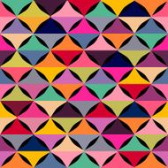 Abstract geometric seamless pattern with multicolored shapes