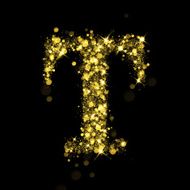 Sparkling letter T of glittering stars bokeh
